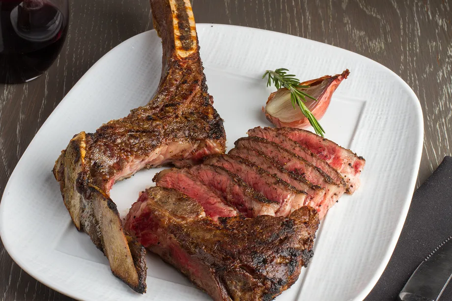 Sliced bone-in steak from Knife